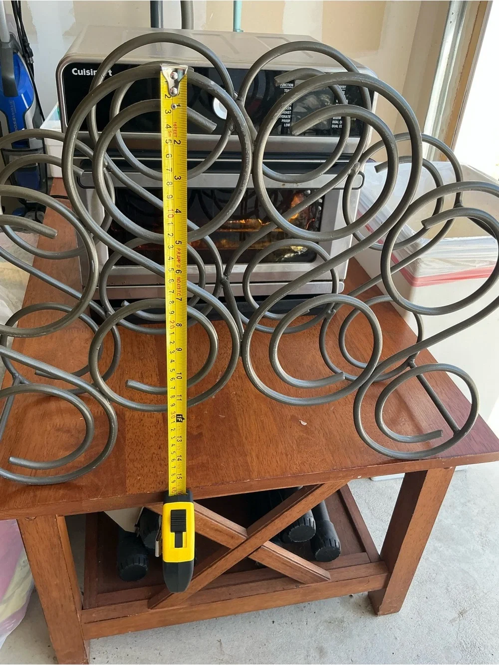This is Vintage iron wine rack features a heavy scroll design and holds 8 bottle